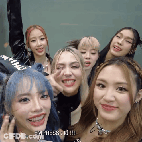 A Group Of Girls Are Posing For A Picture And One Of The Girls Says Empress GIF