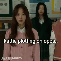 A Group Of Girls Are Standing In A Classroom And One Of Them Is Wearing A Pink Sweater . GIF