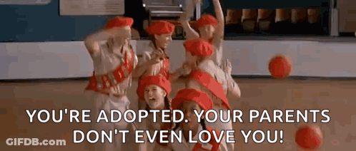 A Group Of Girls In Red Hats Are Dancing On A Stage While Holding Basketballs . GIF