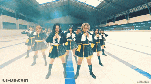 A Group Of Girls In School Uniforms Are Dancing In A Stadium With The Word Jeweler On The Bottom GIF