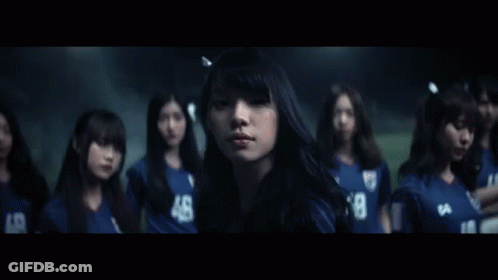 A Group Of Girls Wearing Blue Jerseys With The Number 48 GIF