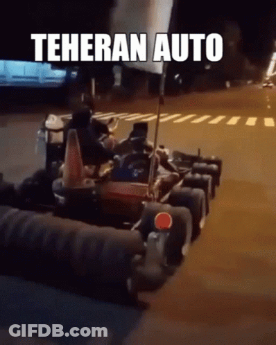 A Group Of Go Karts Are Parked On The Side Of The Road With Teheran Auto Written On The Bottom GIF