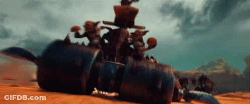 A Group Of Goblins Are Riding On The Back Of A Monster Vehicle GIF