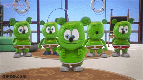 A Group Of Gummy Bears Are Standing In A Room With The Word Gummy Bears On The Bottom GIF