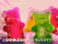 A Group Of Gummy Bears Standing Next To Each Other With The Words `` Go Buddy Go Buddy '' GIF