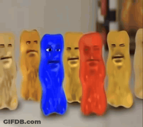 A Group Of Gummy Bears With Faces Are Lined Up In A Row GIF
