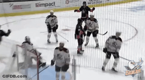 A Group Of Hockey Players Are Playing On A Rink With A Rimpact Banner On The Ice GIF