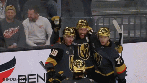 A Group Of Hockey Players Are Posing For A Photo In Front Of A Ben Sign GIF