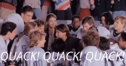 A Group Of Hockey Players Are Sitting In A Huddle With The Words Quack ! Quack ! Quack . GIF