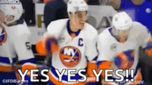 A Group Of Hockey Players Are Standing On The Ice And One Of Them Is Wearing A Jersey With The Letter C On It . GIF