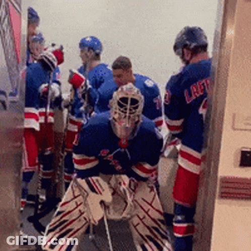 A Group Of Hockey Players One Of Whom Is Wearing A Jersey That Says Laft GIF