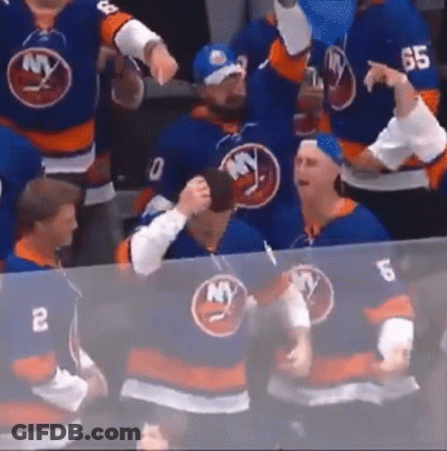 A Group Of Hockey Players Wearing Blue Jerseys With Ny On Them . GIF