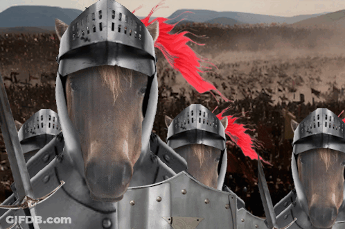 A Group Of Horses Wearing Armor And Helmets Are Standing In A Field GIF