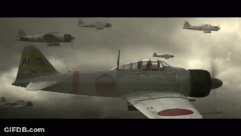 A Group Of Japanese Fighter Jets Are Flying In The Sky . GIF