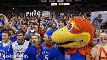 A Group Of Kansas Basketball Players Are Celebrating Their Win GIF