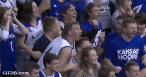 A Group Of Kansas Hoops Fans Are Cheering In The Stands GIF