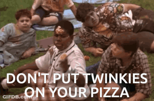 A Group Of Kids Are Laying On The Grass Eating Pizza And One Of Them Has Twinkies On His Face GIF