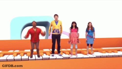 A Group Of Kids Are Standing On A Piano Keyboard GIF