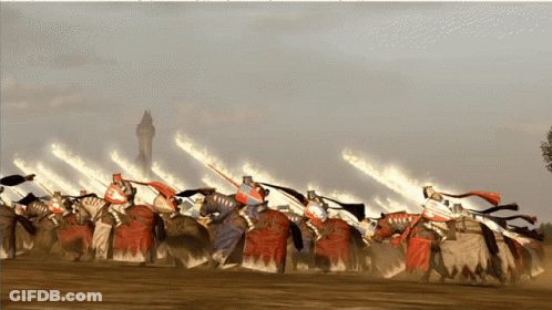 A Group Of Knights On Horses With Flames Behind Them GIF