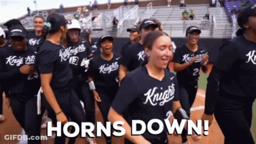 A Group Of Knights Softball Players Are Celebrating Their Victory GIF