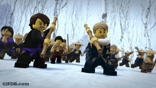 A Group Of Lego Figures Are Standing In The Snow Holding Sticks GIF