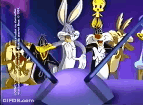 A Group Of Looney Tunes Characters Standing Around A Ball GIF