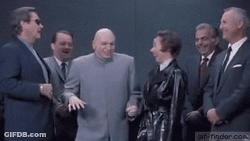 A Group Of Men And A Woman Are Standing Next To Each Other In Suits And Ties . GIF