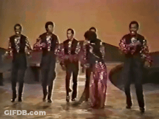 A Group Of Men And Women Are Dancing On A Stage In A Black And White Photo . GIF