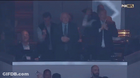 A Group Of Men Applaud In A Fox NFL Stadium GIF