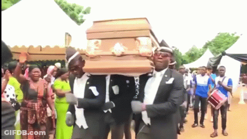 A Group Of Men Are Carrying A Coffin While Dancing GIF