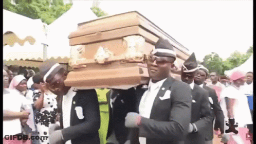 A Group Of Men Are Carrying A Coffin While Dancing . GIF