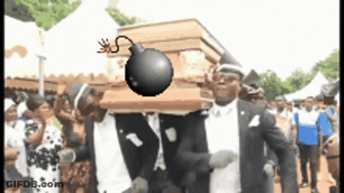 A Group Of Men Are Carrying A Coffin With A Bomb On It 'S Head GIF