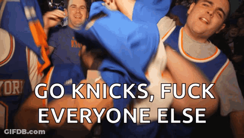 A Group Of Men Are Cheering For The New York Knicks Basketball Team GIF
