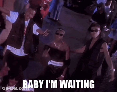 A Group Of Men Are Dancing In A Crowd With The Words Baby I 'M Waiting Above Them GIF