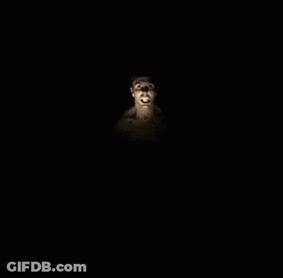 A Group Of Men Are Dancing In A Dark Room With A Man Standing In The Middle . GIF