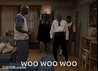 A Group Of Men Are Dancing In A Living Room With The Words `` Woo Woo Woo '' Written On The Screen . GIF