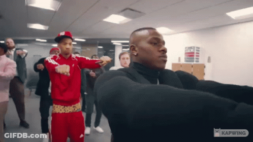 A Group Of Men Are Dancing In A Room With The Word Kapwing On The Bottom GIF