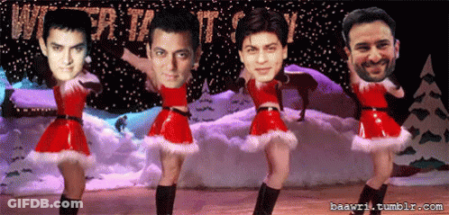 A Group Of Men Are Dancing In Front Of A Sign That Says Christmas GIF
