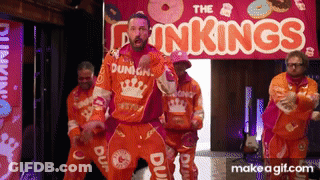 A Group Of Men Are Dancing In Front Of A Sign That Says The Dunkin ' Kings GIF