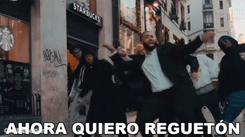 A Group Of Men Are Dancing In Front Of A Starbucks Store GIF