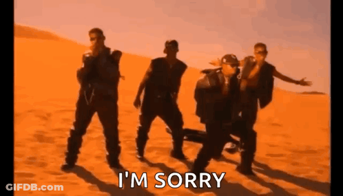 A Group Of Men Are Dancing In The Desert With The Words `` I 'M Sorry '' Written On The Bottom . GIF