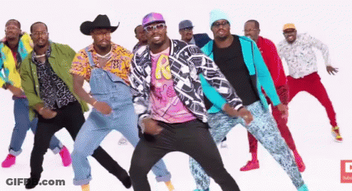 A Group Of Men Are Dancing Together In A Video . GIF