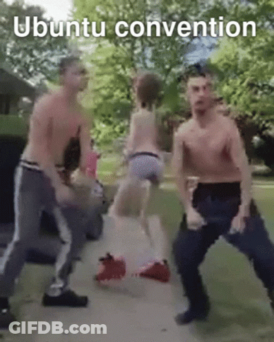 A Group Of Men Are Dancing With The Words Ubuntu Convention Above Them GIF