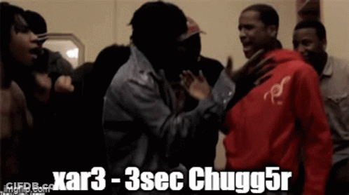 A Group Of Men Are Having A Fight And One Of Them Is Wearing A Red Shirt GIF
