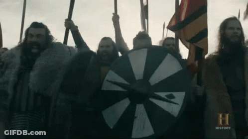 A Group Of Men Are Holding Spears And Shields And The Word History Is On The Bottom Of The Screen GIF