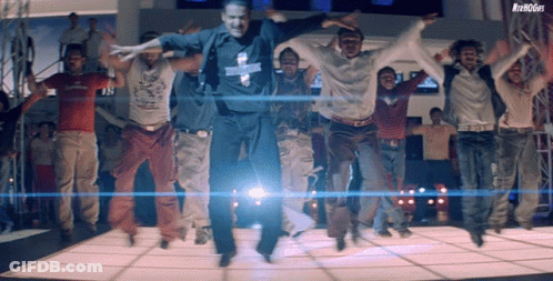 A Group Of Men Are Jumping In The Air While Wearing A Shirt That Says ' Denim Guys ' On It GIF