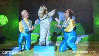 A Group Of Men Are Kneeling In Front Of A Screen That Says [ Adult Swim ] GIF
