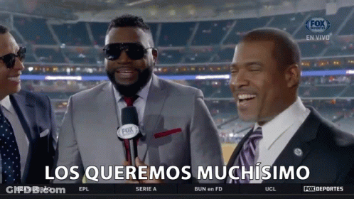 A Group Of Men Are Laughing With The Words Los Queremos Muchisimo On The Bottom GIF