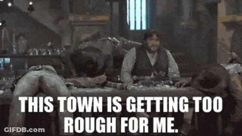 A Group Of Men Are Laying On A Bed With The Words " This Town Is Getting Too Rough For Me " GIF