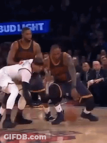 A Group Of Men Are Playing Basketball On A Court With A Bud Light Sign Behind Them . GIF